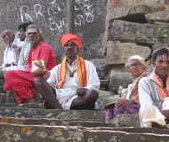 mendicants on stairs